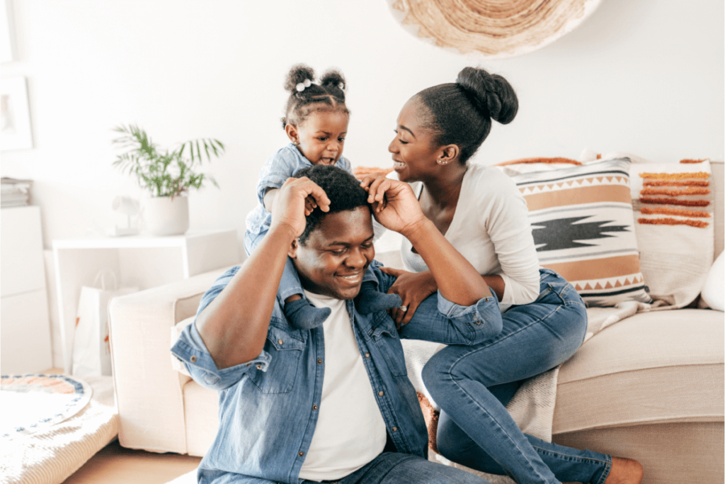 Family gathered in a living room. Types of Life Insurance Exclusions